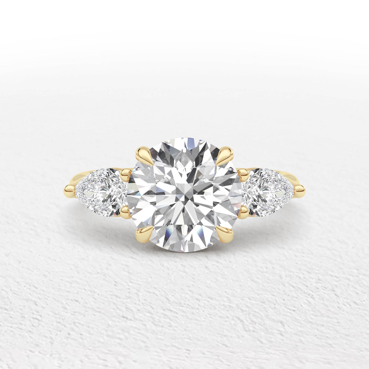 Serena 3.7ct Round and Pear Cut 3 Stone Ring
