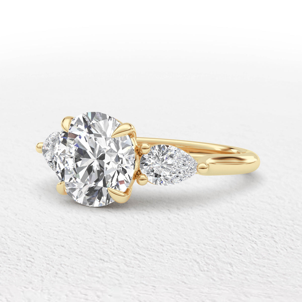 Serena 3.7ct Round and Pear Cut 3 Stone Ring
